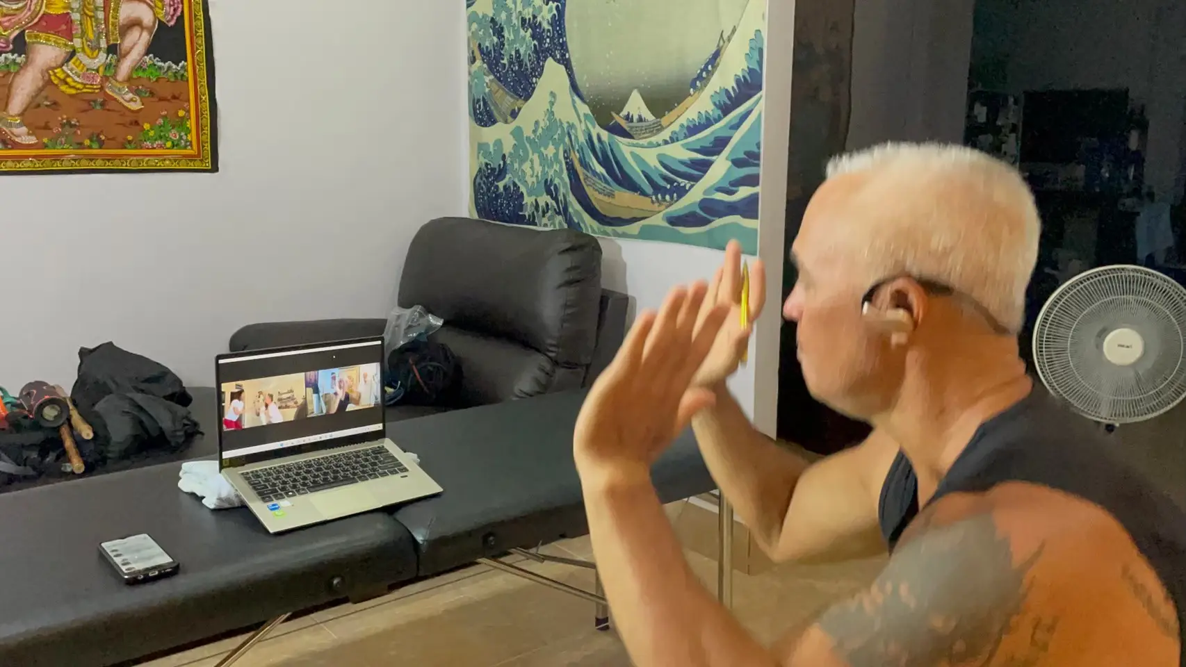 Karol Krauser conducting online group training session via video call with multiple clients from around the world