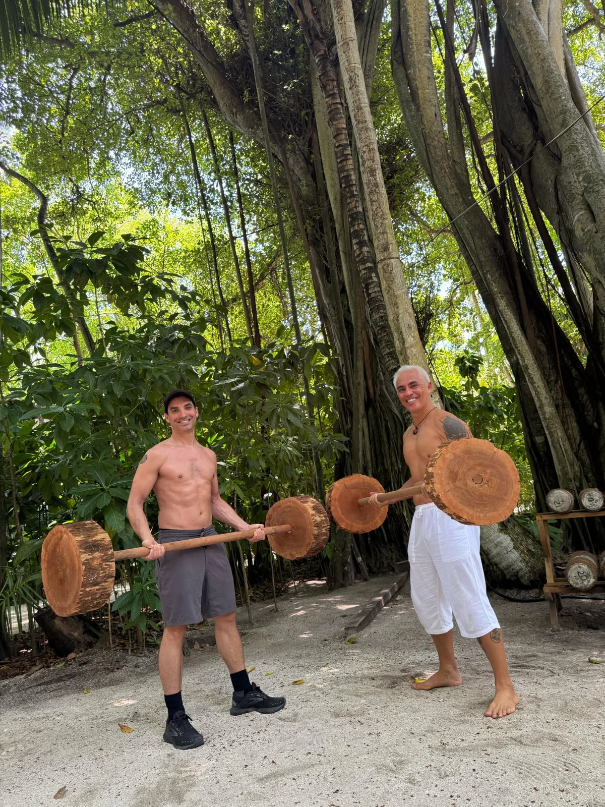 Karol Krauser outdoor jungle fitness training with natural wooden weights at tropical resort Maldives