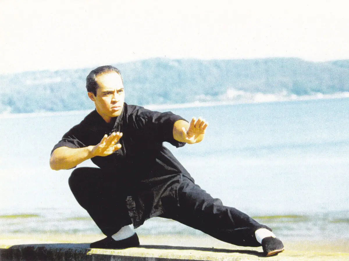 Karol Krauser practicing Tai Chi by the ocean